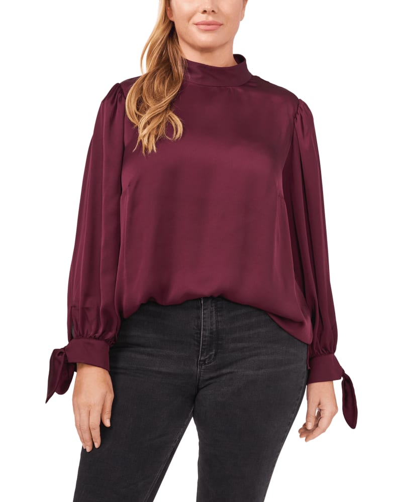 Front of a model wearing a size 1X Kinsley Tie -Sleeve Mock Neck Blouse in 680-RICH CABERNET by CeCe. | dia_product_style_image_id:264004